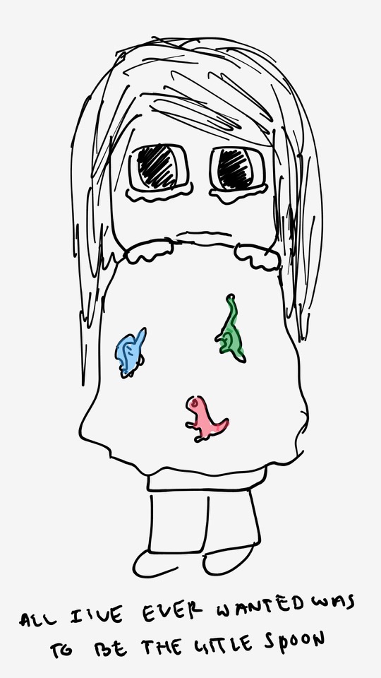 One panel comic. Diana is holding a blanket that has color dinosaurs. Her eyes are huge and teary like a child. She holds the blanket up to her chin. The caption says All I ever wanted was to be the little spoon. Additional commentary starting now.